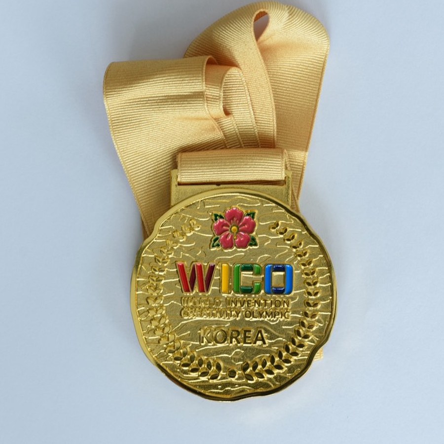 WICO 2026 gold medal with ribbon