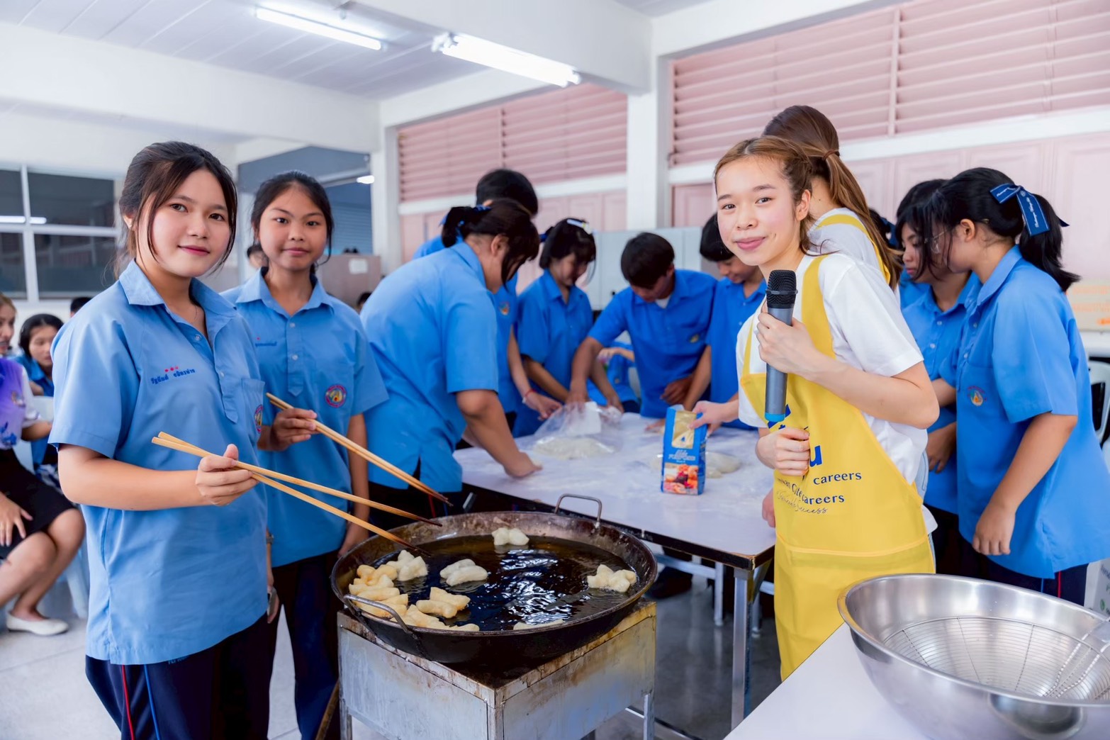 Annie leading a practical culinary training activity with students