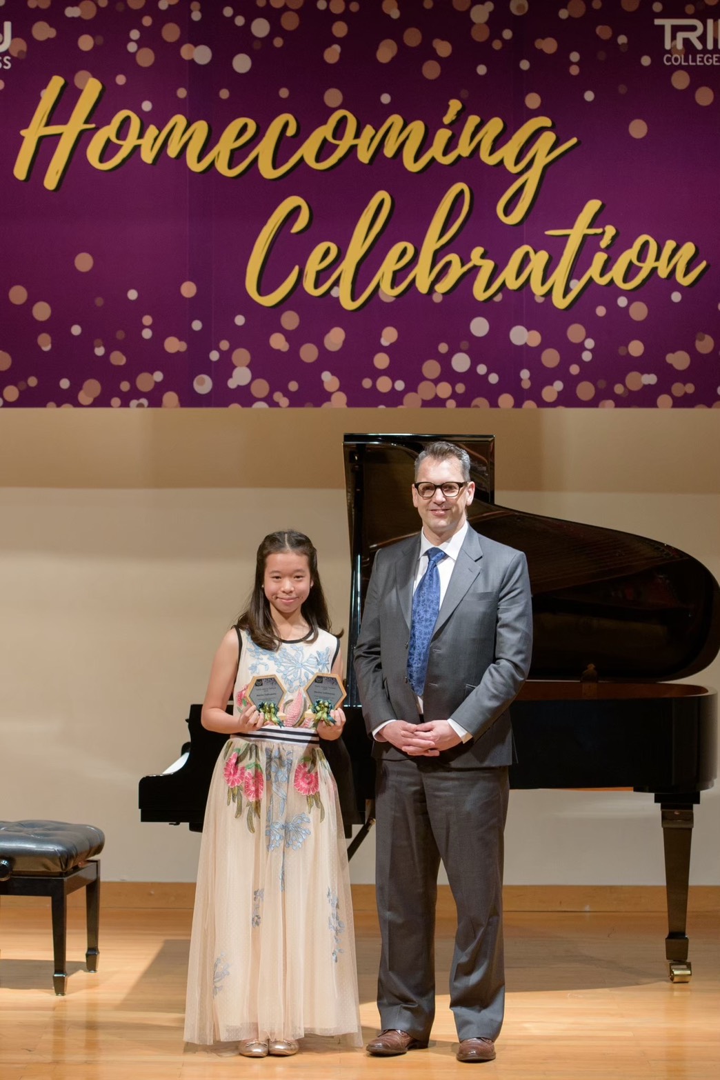 Annie receiving piano awards after a performance