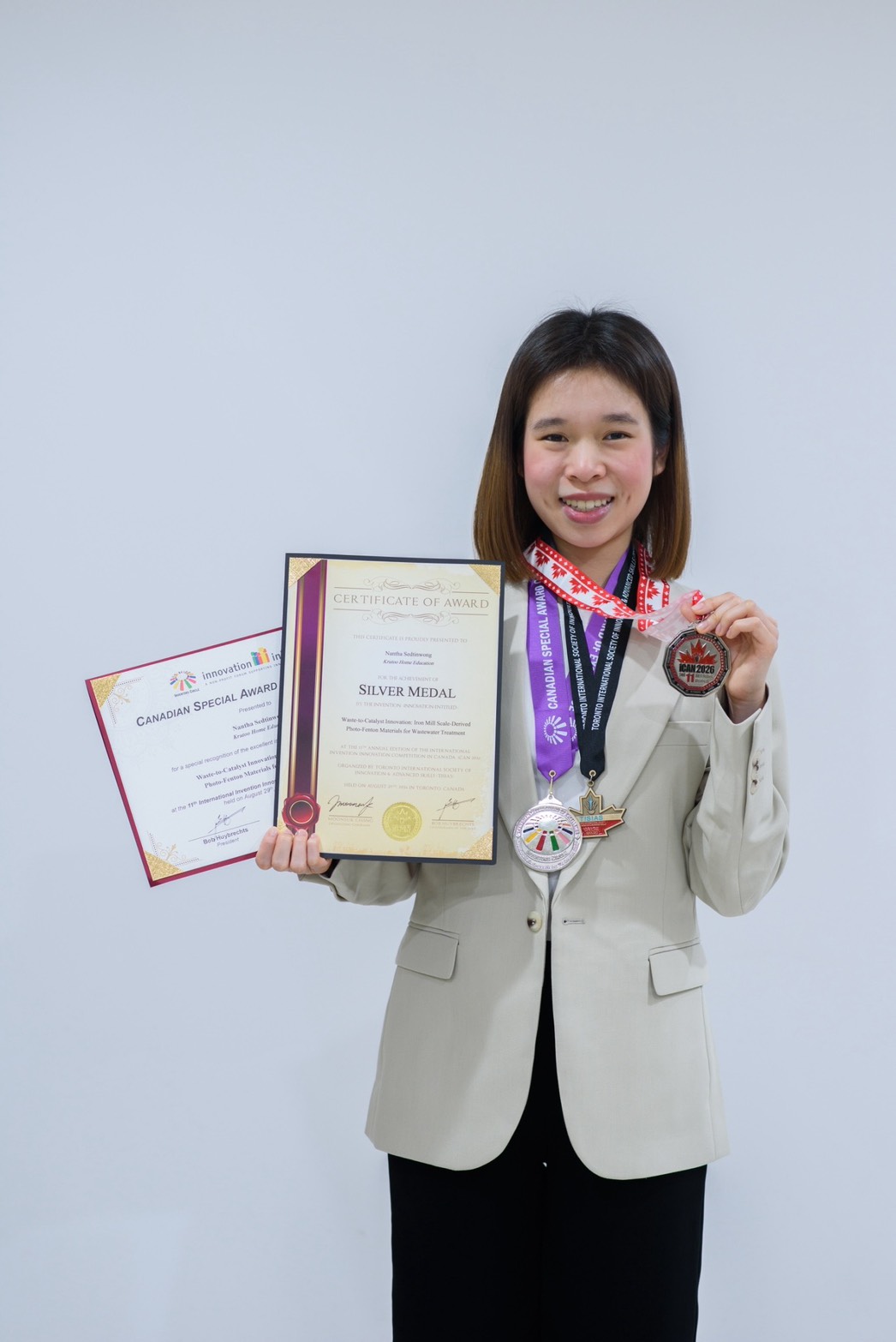 Annie presenting her international research awards and medals