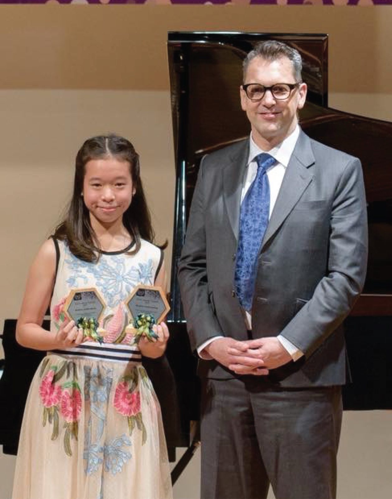 Annie receiving her award at Trinity College London