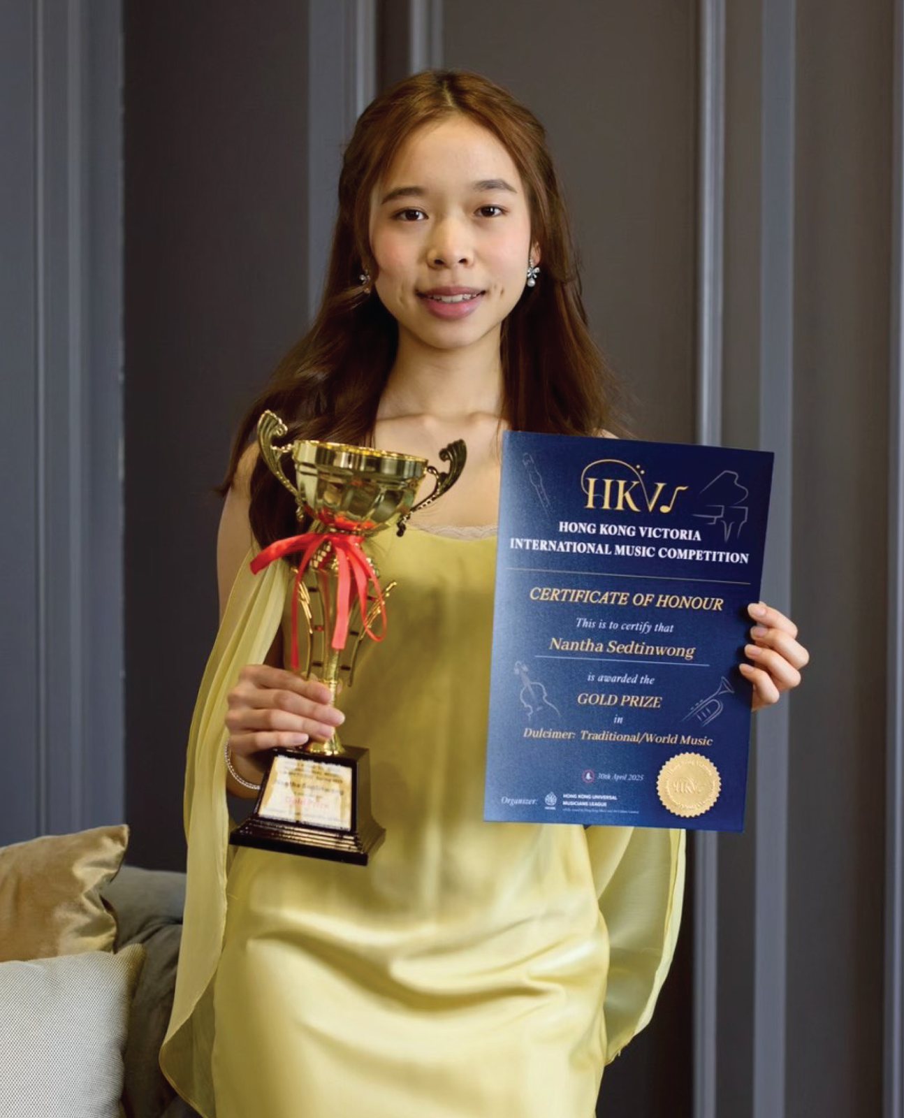 Annie with her Hong Kong Victoria trophy and certificate