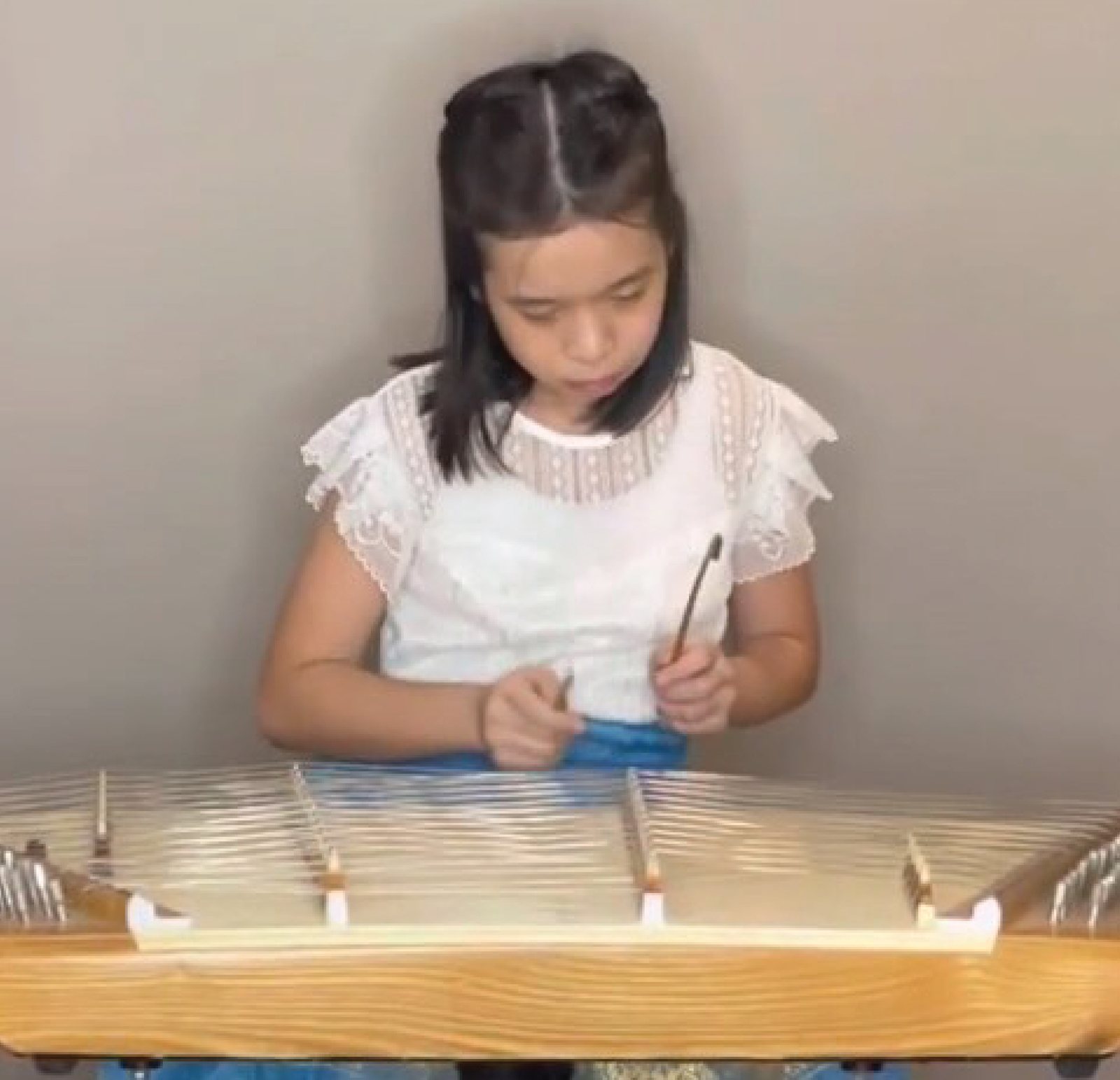 Annie playing the khim