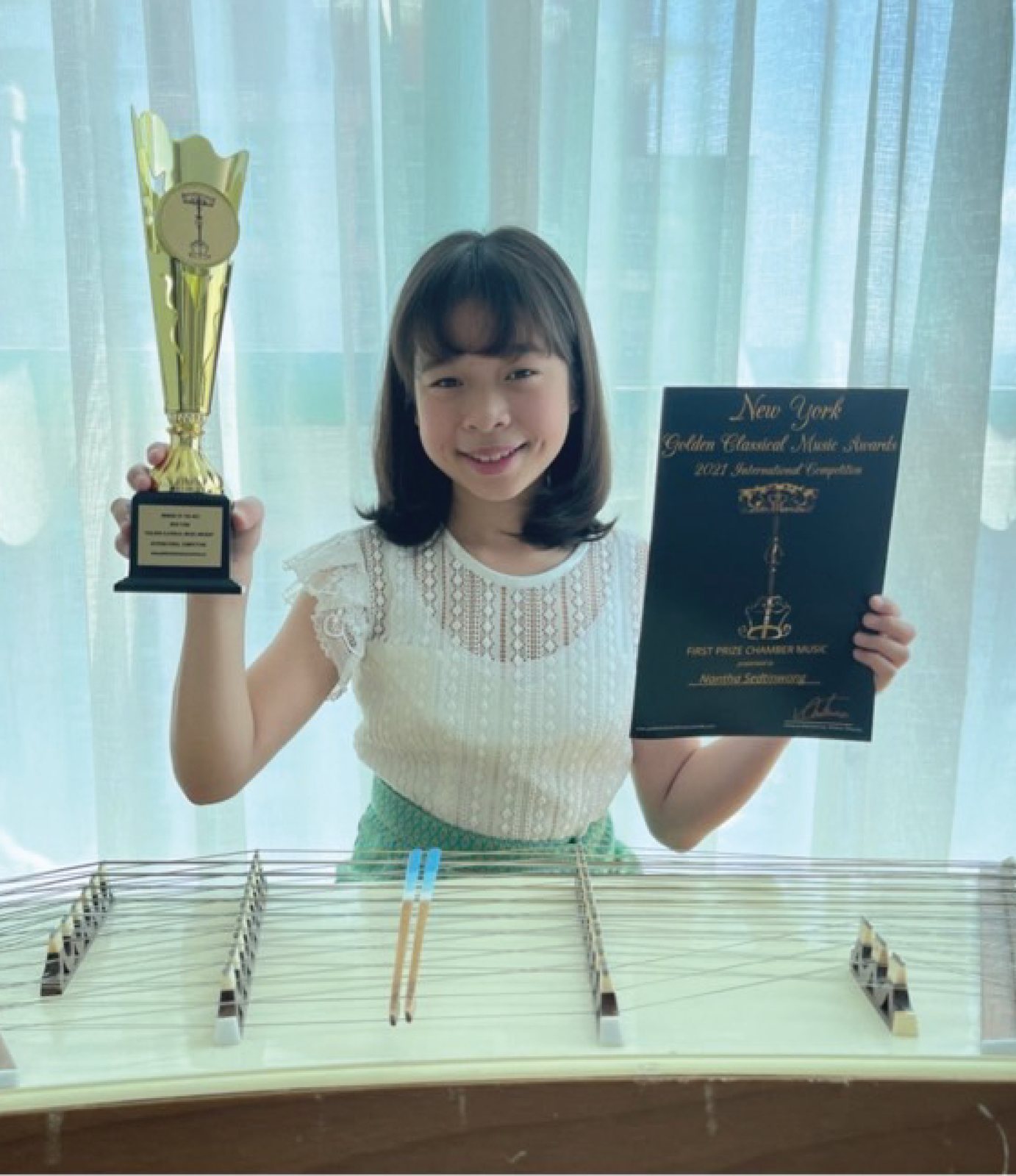 Annie with her New York Golden Classical Music Awards trophy