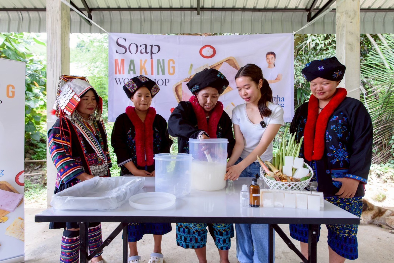 Annie guiding community members as they mix the soap base