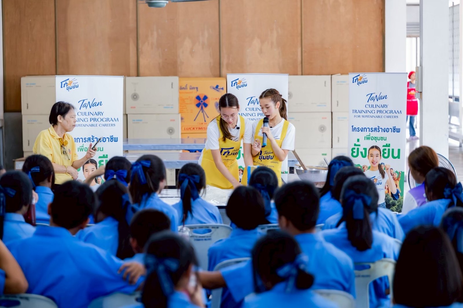 Annie and her sister teaching students at the BMA Vocational Training School, Bang Mot