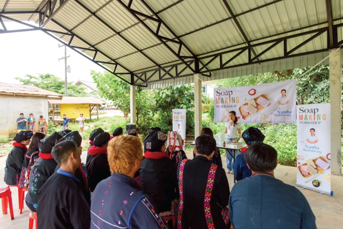 Community members listening to Annie during the soap making workshop