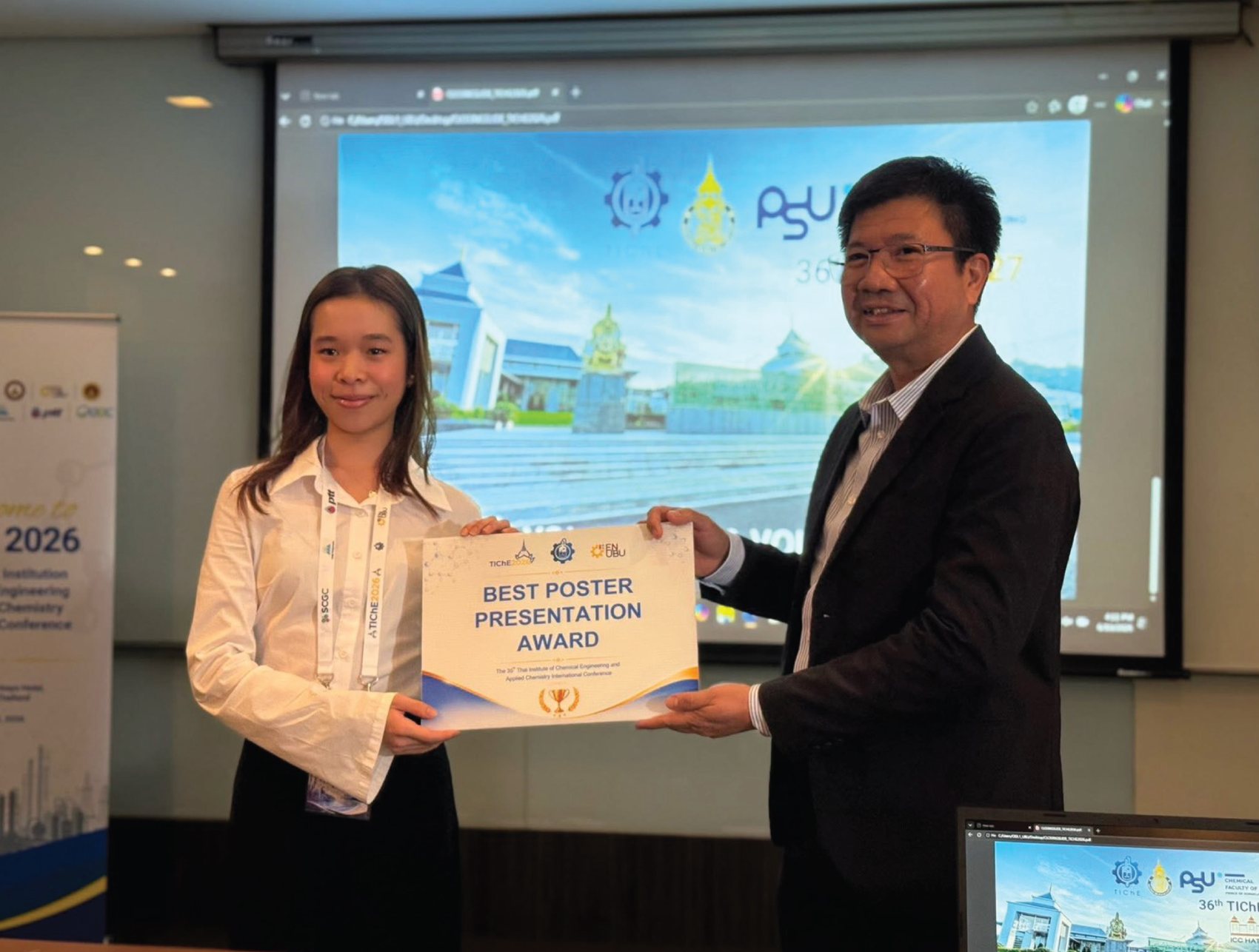 Annie receiving the Best Poster Presentation Award at TIChE 2026